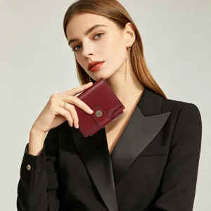 Women's short leather wallet with sunflower snap closure, elegant burgundy card holder purse.