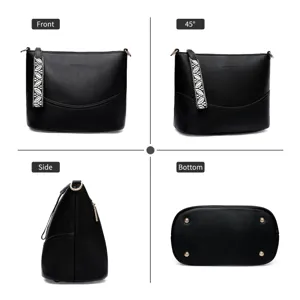 Black PU leather bucket shoulder bag detail view with patterned strap and metal studs.