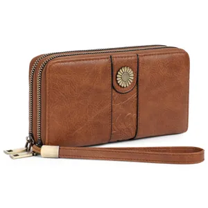 Vintage PU leather long wallet for women with dual zippers, wrist strap and metal flower.