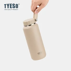 Portable stainless steel insulated water bottle in khaki with convenient carry handle lid.