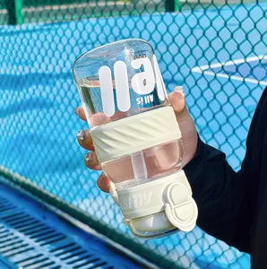 Large capacity sports plastic water bottle with straw and dual-drinking lid for outdoor fitness.