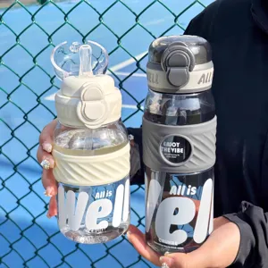 Large capacity plastic sports water bottle for outdoor use with straw and dual drinking mode.