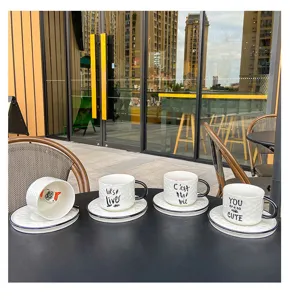 Detailed view of creative ceramic coffee mug set with 3d cat inside and embossed textured design.