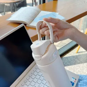 Large capacity stainless steel sports insulated water bottle with portable handle lid for outdoor travel.