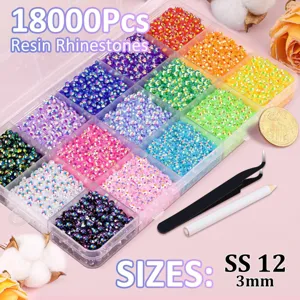 Close-up detail of multi-compartment resin rhinestone storage box set with tools and colorful beads.