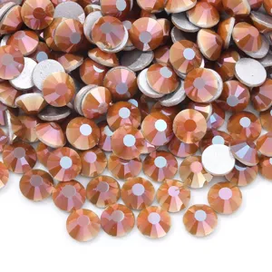 Close-up detail of sparkling orange flatback rhinestones, perfect for nail art and DIY crafts.