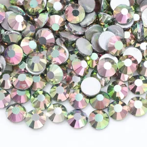 Detailed view of colorful glass flatback rhinestones for DIY nail art and crafts.