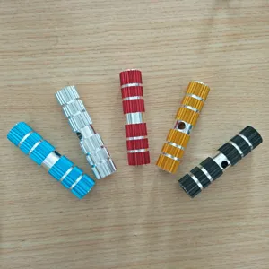Close-up detail of multi-color aluminum bicycle pegs, rear stunt footrests showcase.