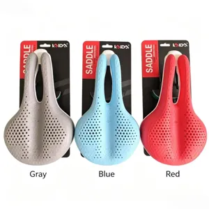 Hollow silicone bicycle saddle detail showing gray, blue and red options on packaging cards.