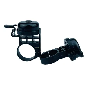Close up detail of black plastic bicycle bell with hand lever and mounting clamp feature.