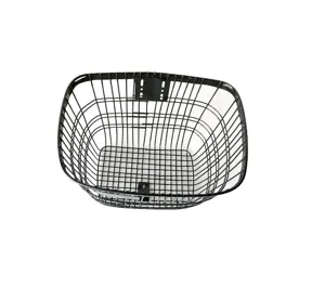 Detail view of a black metal wire bicycle front basket detail accessory, sturdy design.