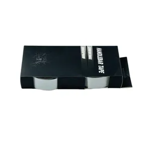 Detail view of bicycle handlebar tape in black box packaging featuring comfortable shockproof design.