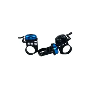 Detailed view of mechanical bicycle handlebar bell with thumb lever and durable mounting ring.