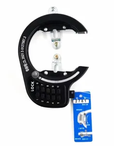 Detailed view of black bicycle combination ring lock with mechanical keypad and instruction tag.