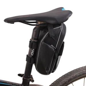 Durable waterproof bicycle saddle bag with carbon fiber texture, secure strap mount for mountain bikes.