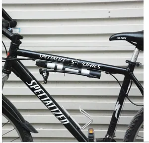 Portable mini bicycle high pressure aluminum alloy pump mounted on bike frame accessory.