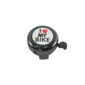 Black bicycle bell detail showing the classic round metal shell and I love my bike text.