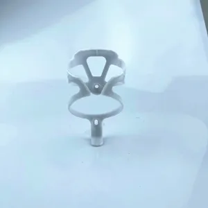 Detailed close-up view of the white lightweight plastic bicycle water bottle cage for cycling.