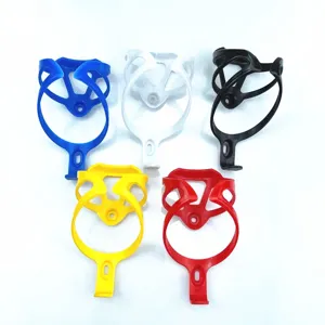 Detailed view of lightweight plastic bicycle bottle cages in multi colors for cycling gear.