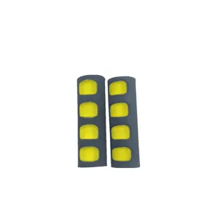 Mountain bike handlebar grips detail shot, soft sponge material with ergonomic yellow foam padding.