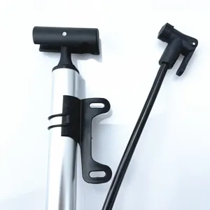 Portable mini aluminum alloy bicycle pump with mounting bracket for outdoor cycling use.