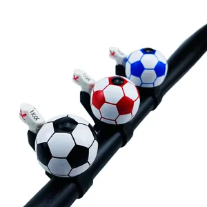 Colorful soccer bike bell detail shot, fun bicycle handlebar bell for kids mountain bikes.
