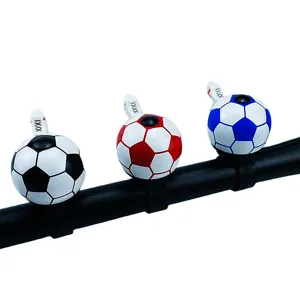 Detailed view of colorful soccer shape bicycle bells in black, red and blue. Great bike accessory.