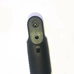 Close-up detail of a black portable bicycle mini pump nozzle head, valve connector part.