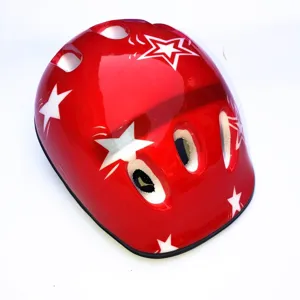 Children red helmet with white stars, multi-vent design for safe cycling and outdoor sports.