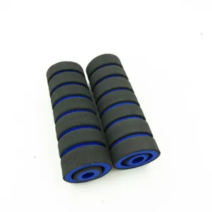 Black and blue foam handlebar grip detail, anti-slip motorcycle part surface close-up.