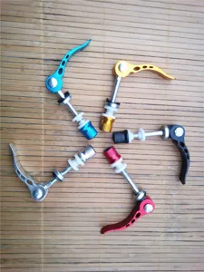 Detailed view of aluminum alloy bicycle quick release seatpost clamp skewer in five colors.