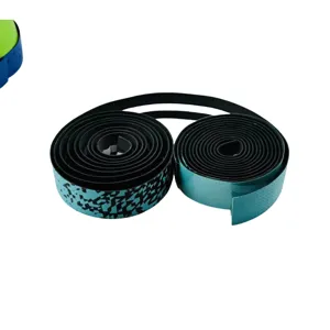 Detailed shot of gradient bicycle handlebar tape, showing textured surface and neat rolled shape.