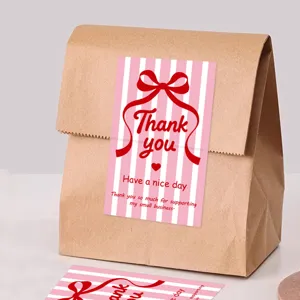 Etichette adesive di ringraziamento a righe rosa con fiocco rosso per confezioni regalo.