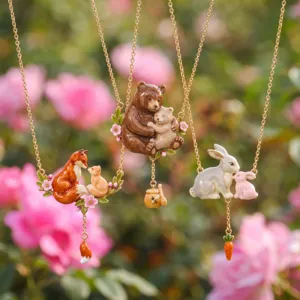 Cute animal enamel pendant necklace detail showcasing fox, bear, and rabbit family designs.