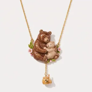 Detailed close-up shot of the cute brown bear mother and baby enamel pendant necklace.
