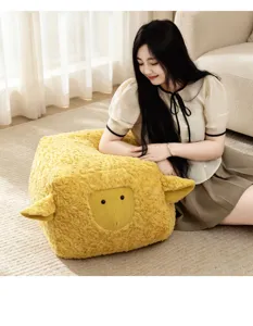 Detailed view of the cute yellow sheep plush cushion, perfect for cozy bedroom decor.