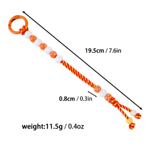 Detailed view of handmade woven golf score bead counter keychain with colorful braided rope.