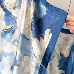 Elegant blue floral silk scarf detail, soft fabric texture, spring summer fashion accessory