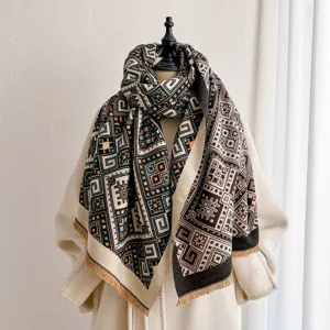 Close-up detail of geometric jacquard knit scarf and shawl with stylish fringe hem, warm.