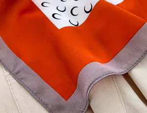 Mulberry silk square scarf with trendy crescent moon print, orange and purple border.
