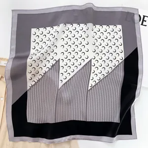 Women's silk square scarf featuring chic crescent moon patterns, elegant grey and black chic design.