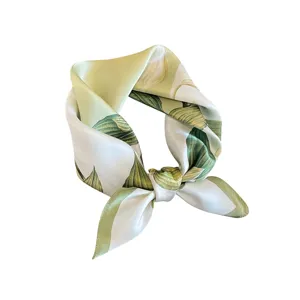Silk square scarf for women with elegant green botanical leaf print, chic neck accessory.