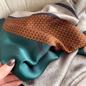 Detail view of color-blocked silk scarf with houndstooth pattern for women summer styling.