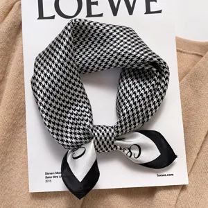 Classic black and white houndstooth silk scarf, stylish neckerchief and hair accessory.