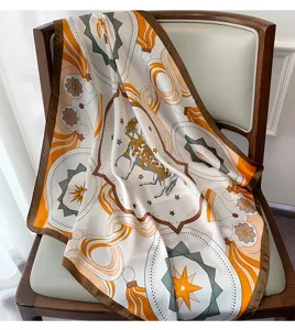 Detailed shot of the elegant printed silk square scarf featuring classic horse motif and chic geometry.