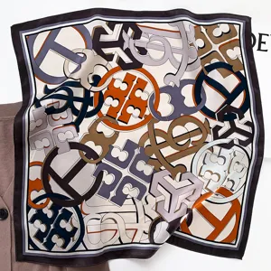Silk square scarf featuring geometric print, an elegant neckerchief for women.