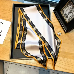 Elegant narrow silk scarf with chic chain and clock print, versatile for neck, hair, or bag.