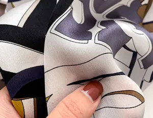 Close-up of luxury mulberry silk square scarf showcasing smooth texture, elegant abstract print.