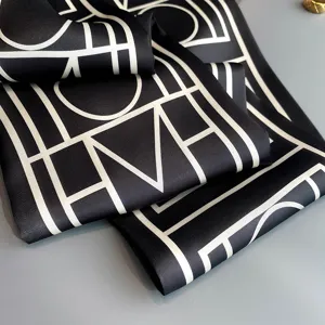 Black and white geometric print silk scarf, elegant twilly ribbon for women hair and neck styling.