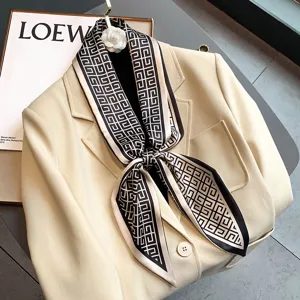 Detailed view of fashionable geometric print silk scarf tied neatly on chic beige blazer jacket.